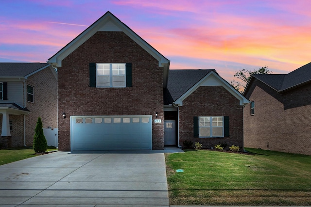 272 Thorpe Dr, Spring Hill, TN 37174 - traditional home featuring brick siding, concrete driveway, an attached garage, and a yard