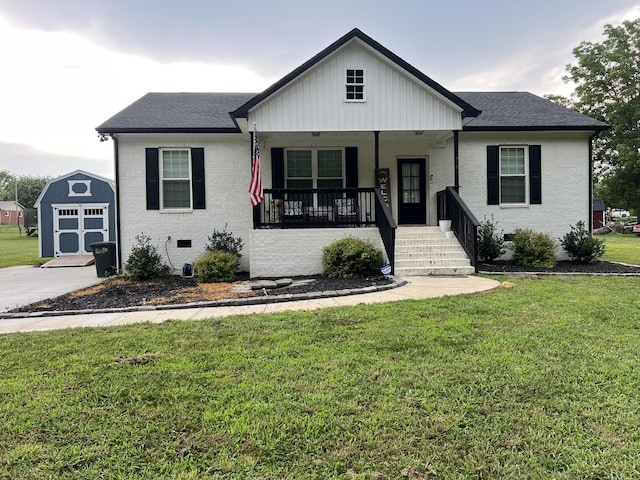 484 Royal Dr, Rock Island, TN 38581 - view of front facade with covered porch, a front yard, a shed, and roof with shingles