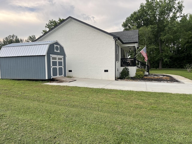 484 Royal Dr, Rock Island, TN 38581 - rear view of house with a lawn, a storage unit, crawl space, and brick siding