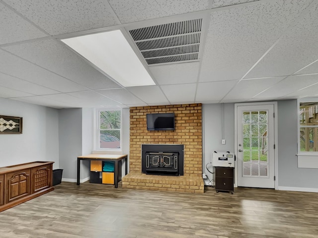 209 River Dr, Mount Juliet, TN 37122 - living room with wood finished floors, a drop ceiling, and a brick fireplace