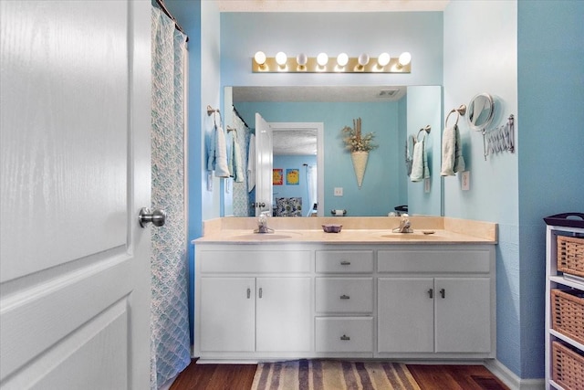 1311 Clifford Dr, Murfreesboro, TN 37129 - bathroom with wood finished floors and double vanity