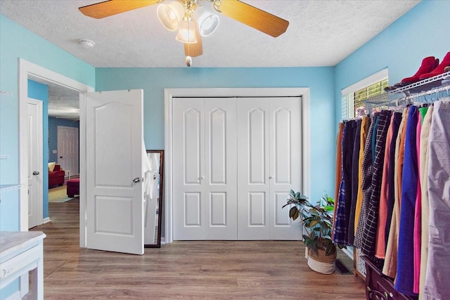 1311 Clifford Dr, Murfreesboro, TN 37129 - bedroom with a textured ceiling, wood finished floors, a closet, and a ceiling fan