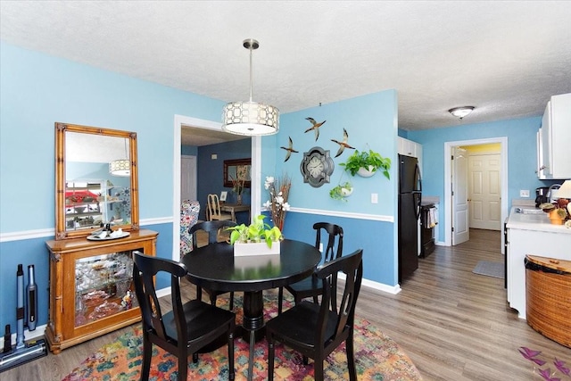 1311 Clifford Dr, Murfreesboro, TN 37129 - dining area with light wood-type flooring and a textured ceiling