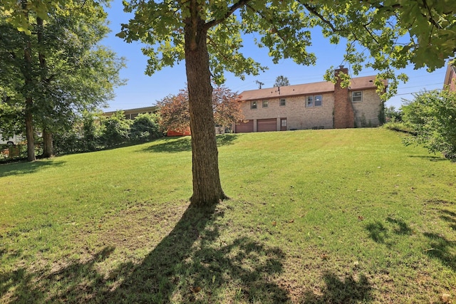 2604 Forest View Dr, Antioch, TN 37013 - view of grassy yard with an attached garage