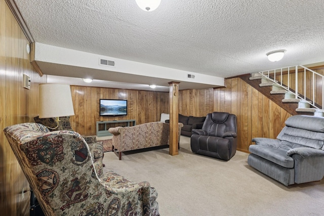 2604 Forest View Dr, Antioch, TN 37013 - carpeted living area with wooden walls, stairway, and a textured ceiling