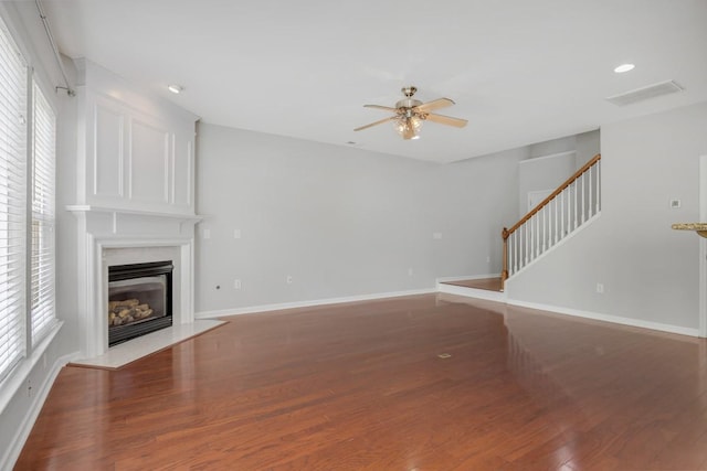 446 Lazy Creek Ln, Nashville, TN 37211 - unfurnished living room with a ceiling fan, wood finished floors, a premium fireplace, stairs, and recessed lighting
