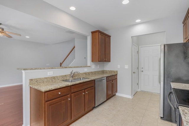 446 Lazy Creek Ln, Nashville, TN 37211 - kitchen with dishwasher, range with electric stovetop, a ceiling fan, light stone countertops, and a peninsula