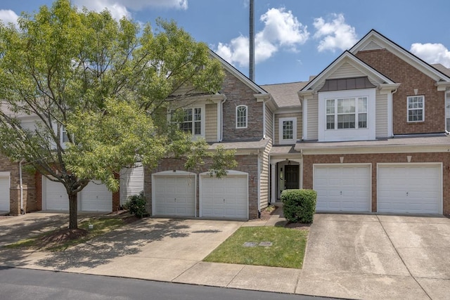 446 Lazy Creek Ln, Nashville, TN 37211 - multi unit property featuring an attached garage, driveway, and brick siding