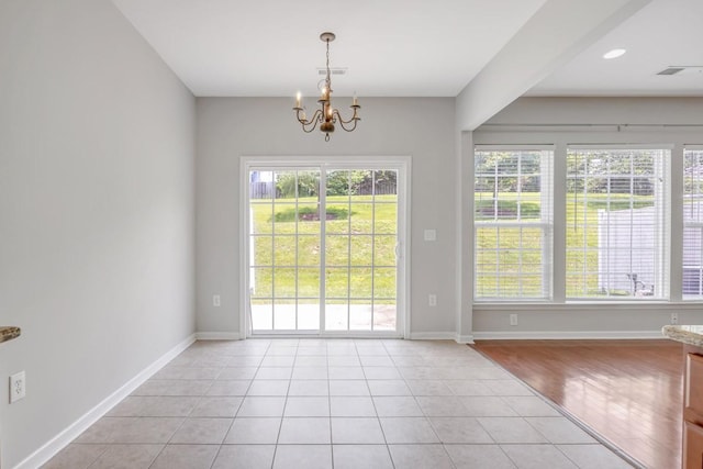 446 Lazy Creek Ln, Nashville, TN 37211 - unfurnished dining area featuring a chandelier and light tile patterned floors