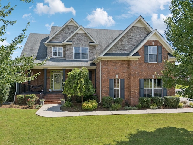 2819 Silver Springs Ct, Murfreesboro, TN 37128 - craftsman-style home with a front yard, covered porch, and brick siding
