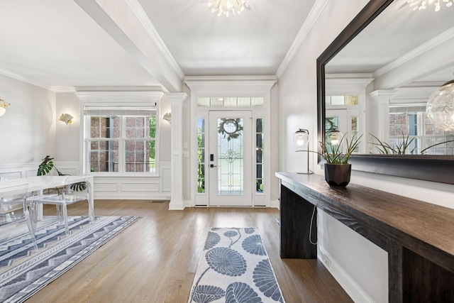 2819 Silver Springs Ct, Murfreesboro, TN 37128 - entrance foyer featuring wood finished floors, decorative columns, a chandelier, wainscoting, and crown molding