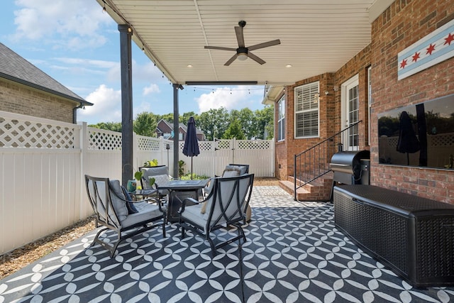 2819 Silver Springs Ct, Murfreesboro, TN 37128 - fenced backyard featuring a ceiling fan, a grill, a patio area, and outdoor dining space