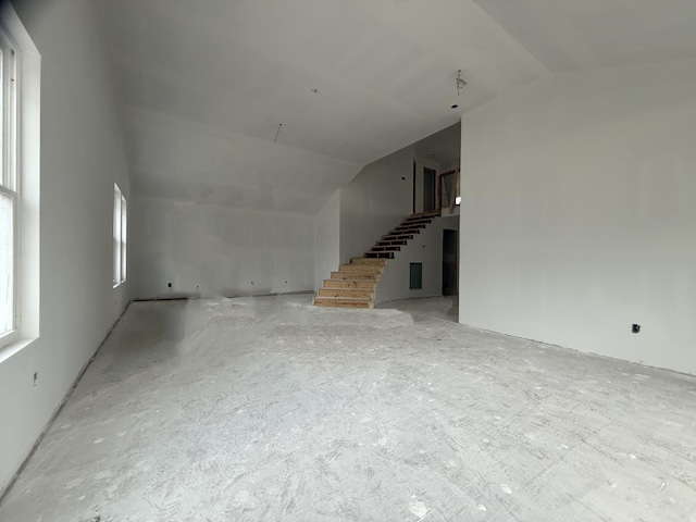 3880 Barfield Crescent Rd, Murfreesboro, TN 37128 - unfurnished living room with lofted ceiling and stairs