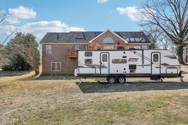 311 Downs Rd, Cumberland City, TN 37050 - rear view of house with a balcony and a yard