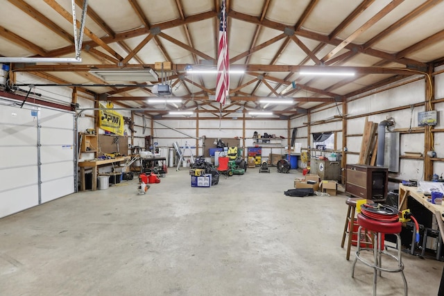 311 Downs Rd, Cumberland City, TN 37050 - garage featuring a workshop area and a garage door opener