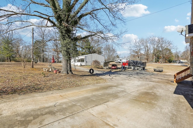 311 Downs Rd, Cumberland City, TN 37050 - view of yard featuring driveway and a detached carport