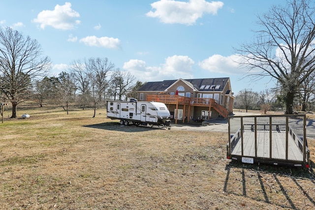 311 Downs Rd, Cumberland City, TN 37050 - rear view of property featuring a wooden deck, stairs, and a yard