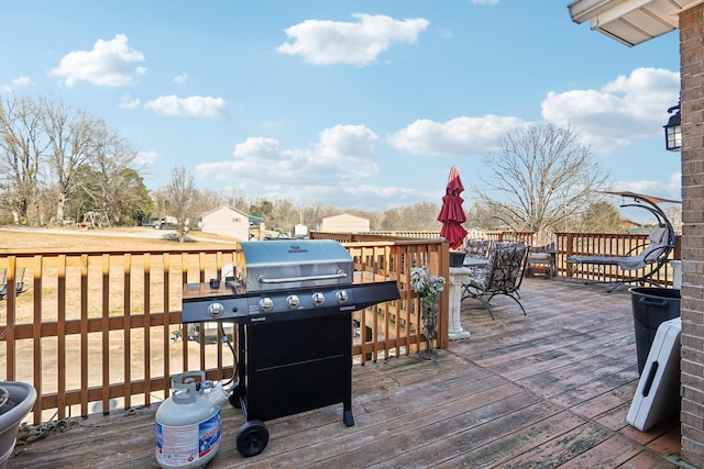 311 Downs Rd, Cumberland City, TN 37050 - wooden terrace featuring a grill and outdoor dining area