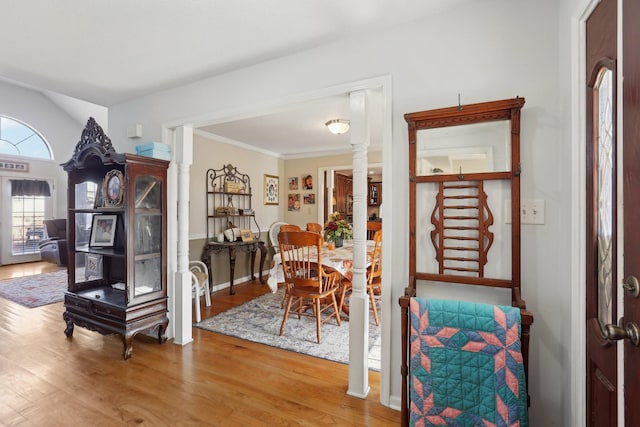 311 Downs Rd, Cumberland City, TN 37050 - dining room featuring wood finished floors, decorative columns, and crown molding