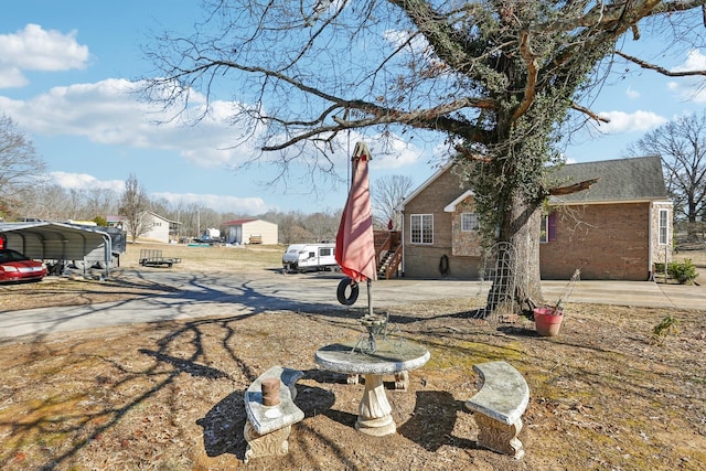 311 Downs Rd, Cumberland City, TN 37050 - view of yard featuring a carport