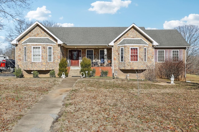 311 Downs Rd, Cumberland City, TN 37050 - single story home featuring stone siding, covered porch, and roof with shingles