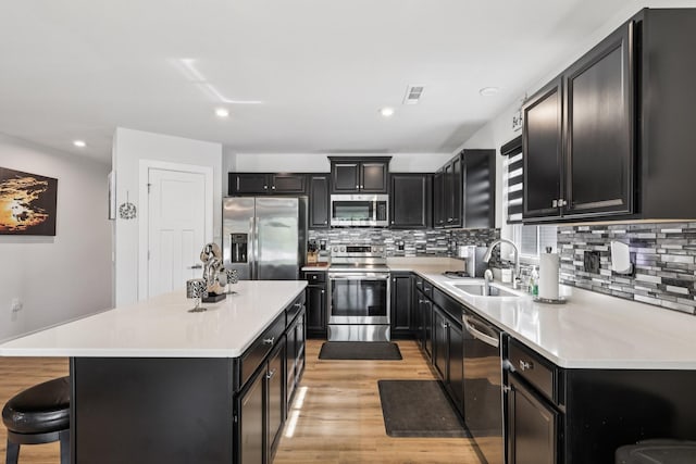 2617 Thornton Grove Blvd, Nashville, TN 37207 - kitchen featuring appliances with stainless steel finishes, dark cabinetry, backsplash, and recessed lighting