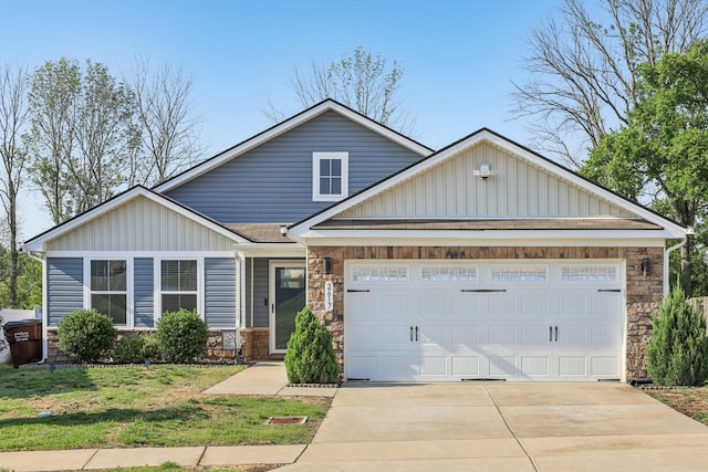 2617 Thornton Grove Blvd, Nashville, TN 37207 - view of front of house featuring stone siding, board and batten siding, concrete driveway, a garage, and a front yard