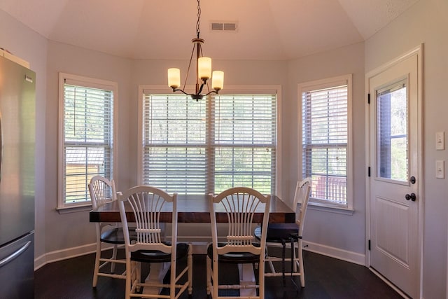 1452 Precept Dr, Murfreesboro, TN 37129 - dining space featuring dark wood-style flooring, healthy amount of natural light, and vaulted ceiling