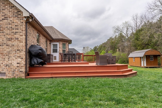 1452 Precept Dr, Murfreesboro, TN 37129 - wooden deck featuring a storage shed, a lawn, and a grill
