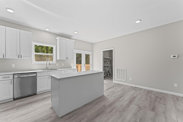 4315 Surji Cir, Centerville, TN 37033 - kitchen with dishwasher, light countertops, white cabinets, light wood-type flooring, and recessed lighting