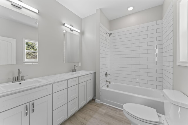 4315 Surji Cir, Centerville, TN 37033 - full bathroom featuring double vanity, wood finished floors, and bathtub / shower combination