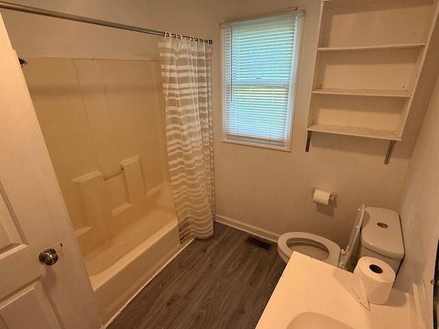 418 W 3rd St, Columbia, TN 38401 - bathroom featuring shower / bathtub combination with curtain and wood finished floors