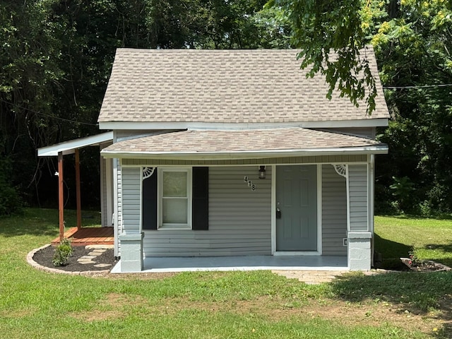 418 W 3rd St, Columbia, TN 38401 - view of front of home with a shingled roof, a porch, and a front lawn
