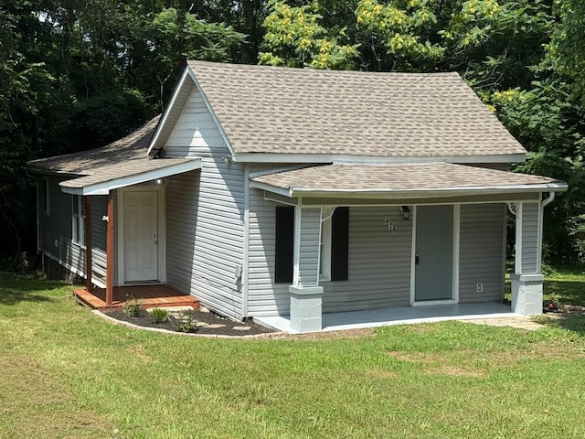 418 W 3rd St, Columbia, TN 38401 - view of front facade with a shingled roof, a front lawn, and a porch