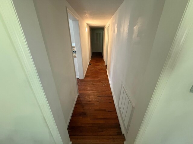 418 W 3rd St, Columbia, TN 38401 - hall with dark wood-type flooring and baseboards