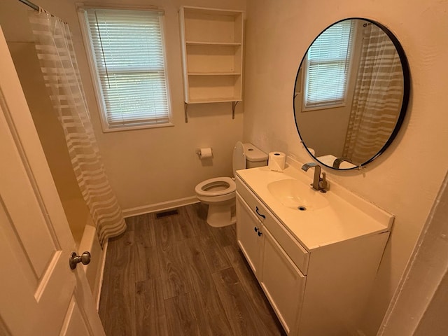 418 W 3rd St, Columbia, TN 38401 - bathroom with vanity, healthy amount of natural light, wood finished floors, and shower / bath combo with shower curtain