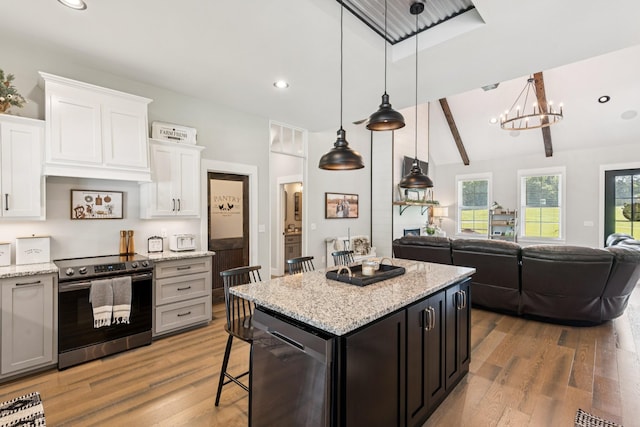 2427 Green Valley Rd, Lafayette, TN 37083 - kitchen featuring stainless steel electric stove, dishwasher, open floor plan, light wood-style flooring, and white cabinets