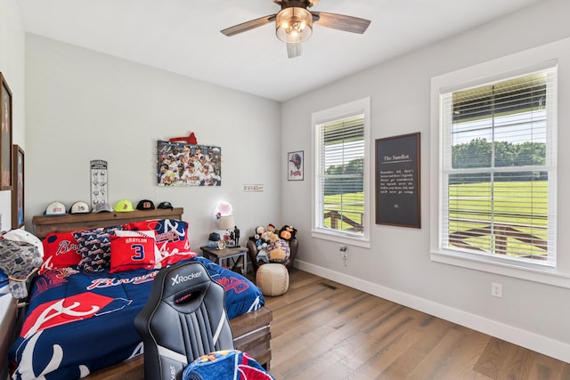 2427 Green Valley Rd, Lafayette, TN 37083 - bedroom with wood finished floors and ceiling fan