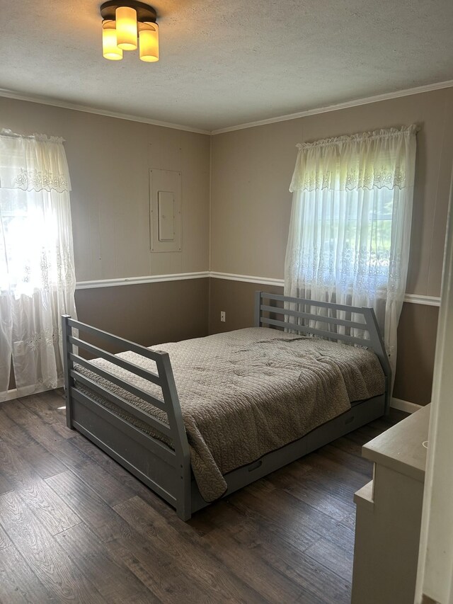 1775 Old Beech Creek Rd, Waynesboro, TN 38485 - bedroom with wood finished floors, crown molding, electric panel, and a textured ceiling