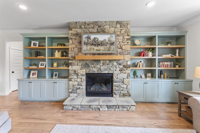 1150 Brixworth Dr, Spring Hill, TN 37174 - living area with crown molding, a fireplace, and light wood-type flooring