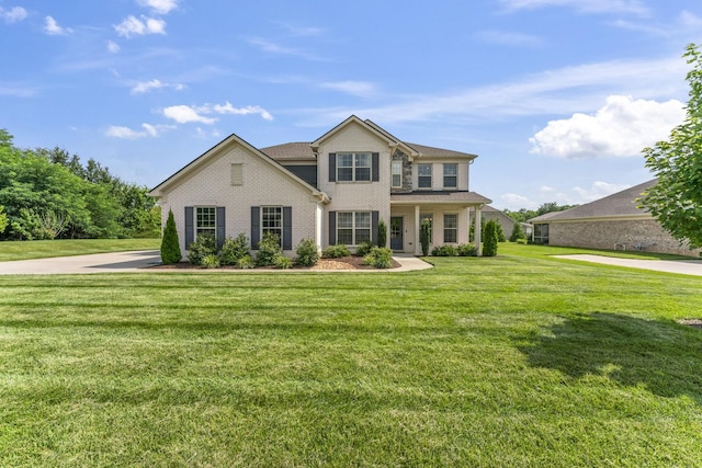 1150 Brixworth Dr, Spring Hill, TN 37174 - view of front facade featuring brick siding and a front lawn