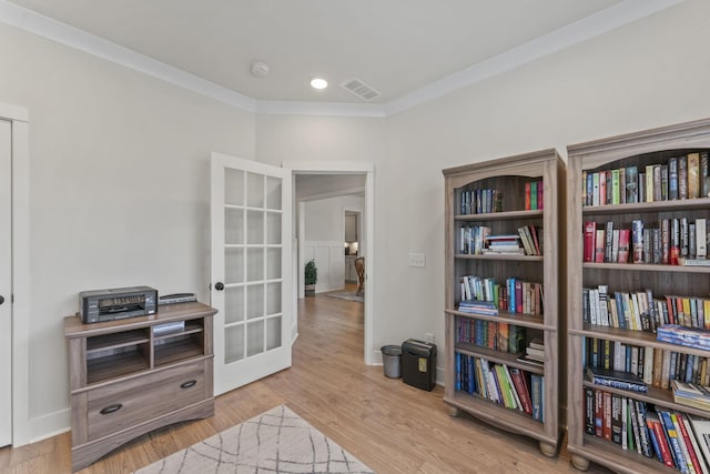 1150 Brixworth Dr, Spring Hill, TN 37174 - living area with ornamental molding, wood finished floors, and french doors