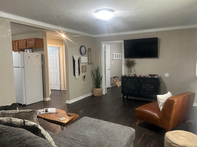 273 E Lake St, Camden, TN 38320 - living area featuring dark wood finished floors, ornamental molding, and a textured ceiling