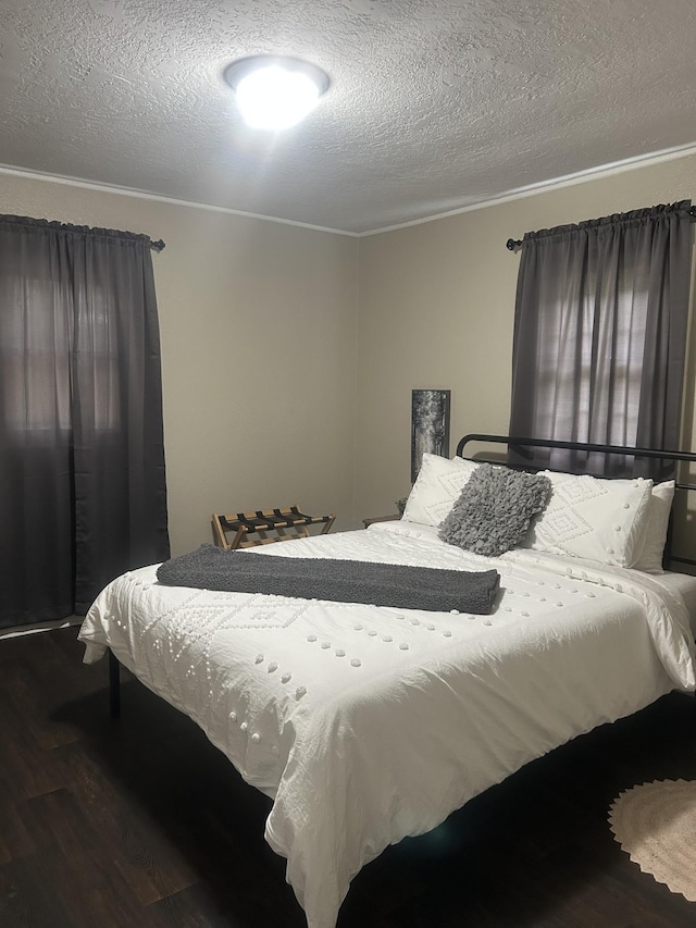 273 E Lake St, Camden, TN 38320 - bedroom featuring wood finished floors, a textured ceiling, and crown molding
