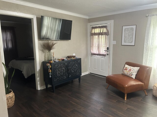 273 E Lake St, Camden, TN 38320 - entrance foyer featuring dark wood-type flooring, crown molding, and a textured ceiling