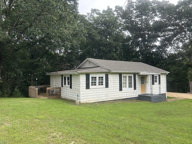 273 E Lake St, Camden, TN 38320 - view of front of home with a front yard and a wooden deck