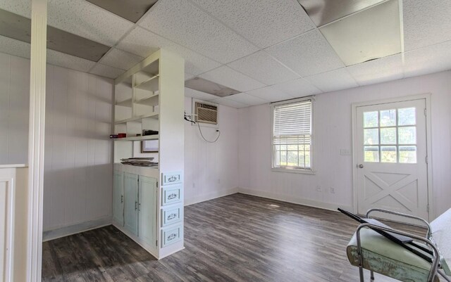 867 Lexington Hwy, Loretto, TN 38469 - interior space featuring a wall mounted AC, dark wood finished floors, and a drop ceiling