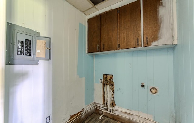 867 Lexington Hwy, Loretto, TN 38469 - laundry area with electric panel, cabinet space, and dark wood-style floors