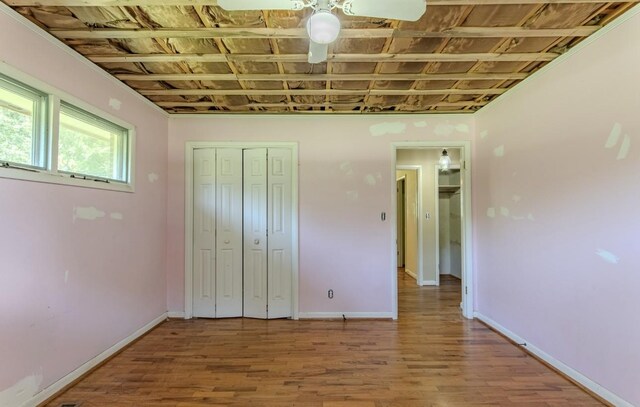 867 Lexington Hwy, Loretto, TN 38469 - unfurnished bedroom with wood finished floors and a closet