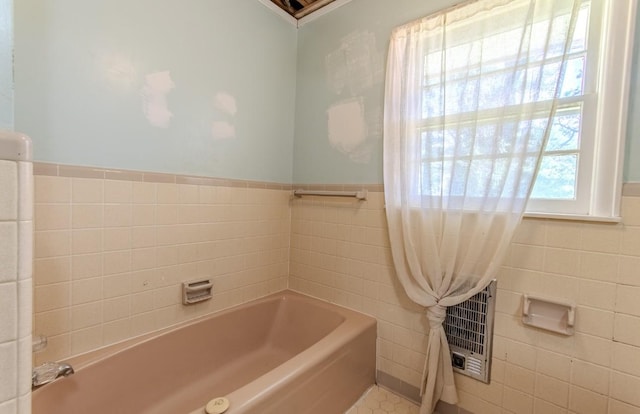 867 Lexington Hwy, Loretto, TN 38469 - full bath featuring tile walls, a garden tub, and wainscoting